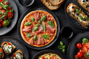 Italian dishes displayed on a table, a Photo by Pavel_design