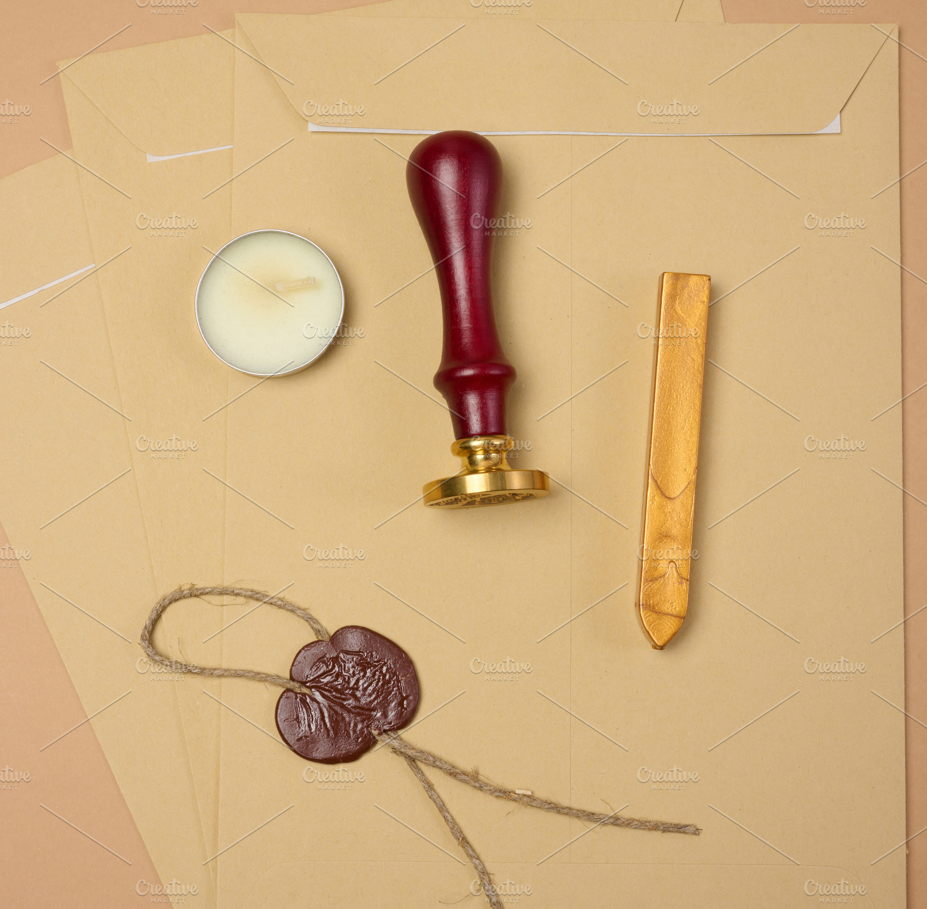 A wax seal kit including wax sticks, candles, stamp and sealed s, an Abstract Photo by ndanko