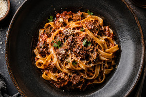 Pasta dish with sauce and herbs, a Photo by Beautiful things