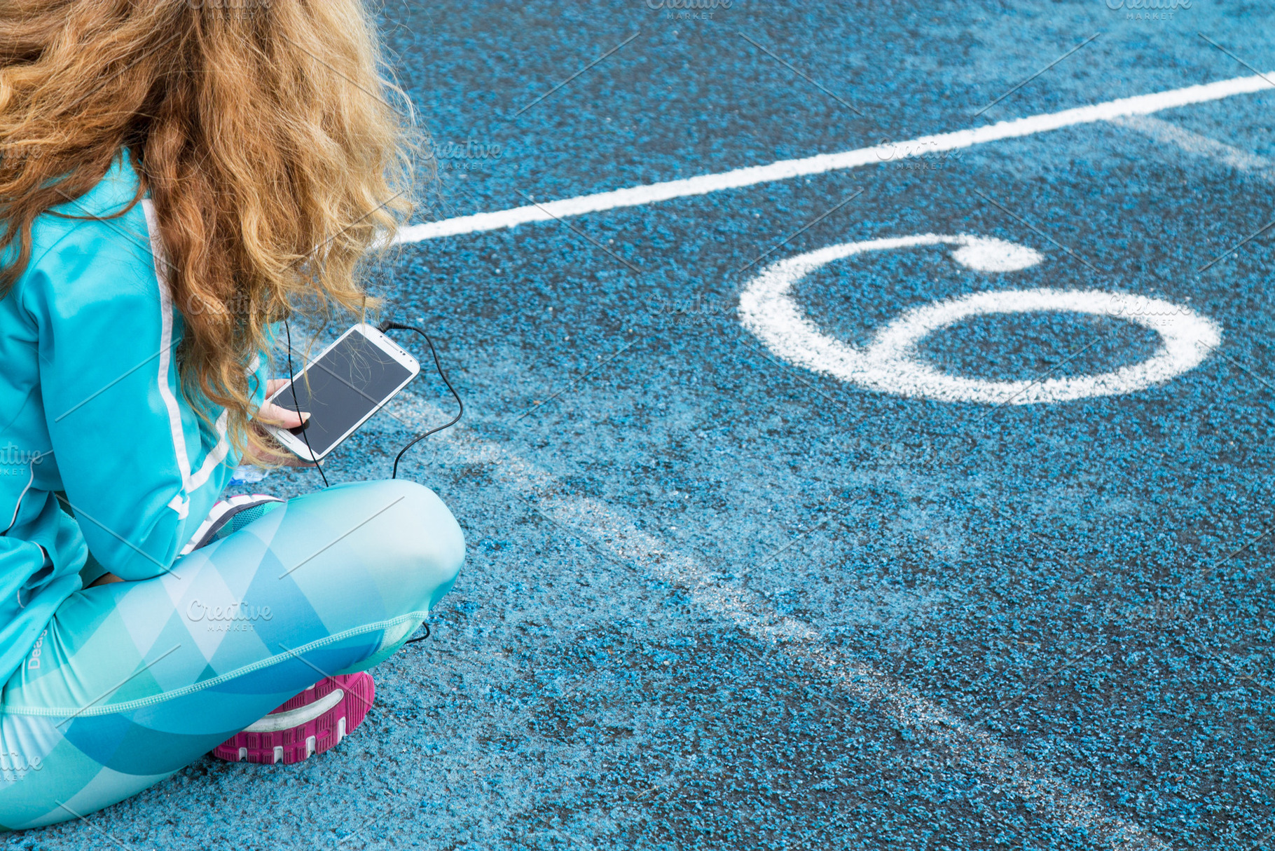 Female runner resting on the track w featuring cellphone, sport, and lifestyle, a Sports & Recreation Photo by tetxu