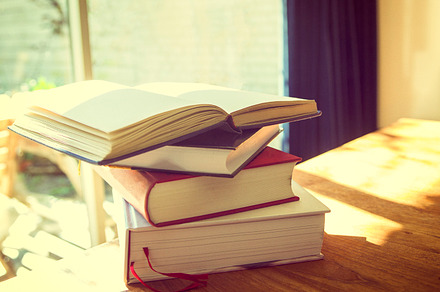 Stack of books in sunlight, a School & Education Photo by Patricia Hofmeester