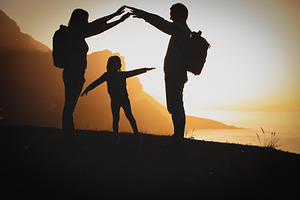 Family in mountains featuring activity, adventure, and backpack