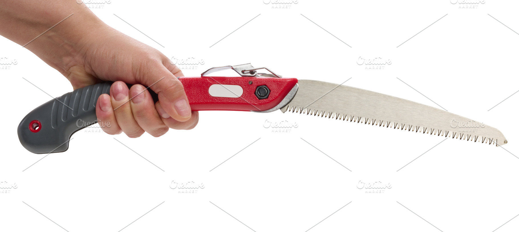 A person holding an unfolded garden saw with a serrated blade, an Industrial Photo by ndanko