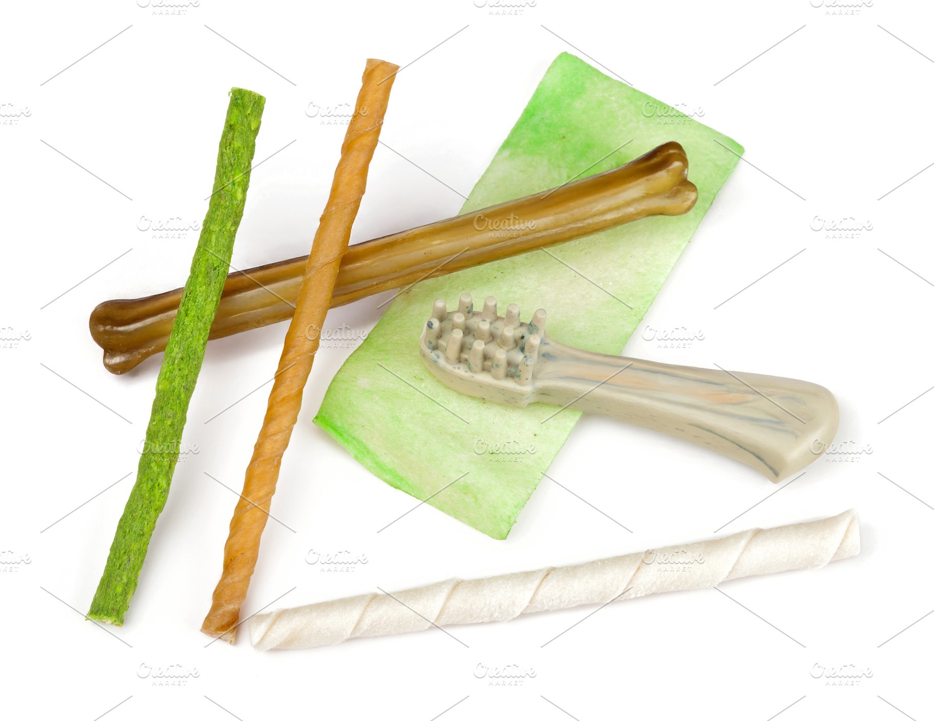 Dog dental hygiene products including bones, snacks and toothbrush promoting ca, an Animal Photo by Antonio Gravante Market