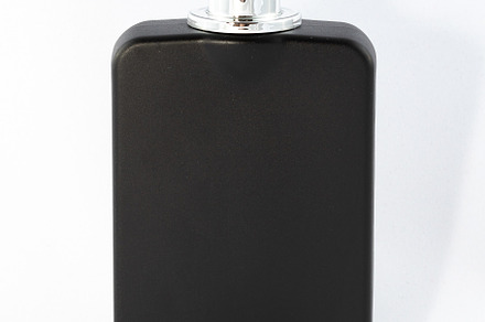 Black Matte Bottle of Perfume for Men on White Background, a Background Photo by InfinitumProdux