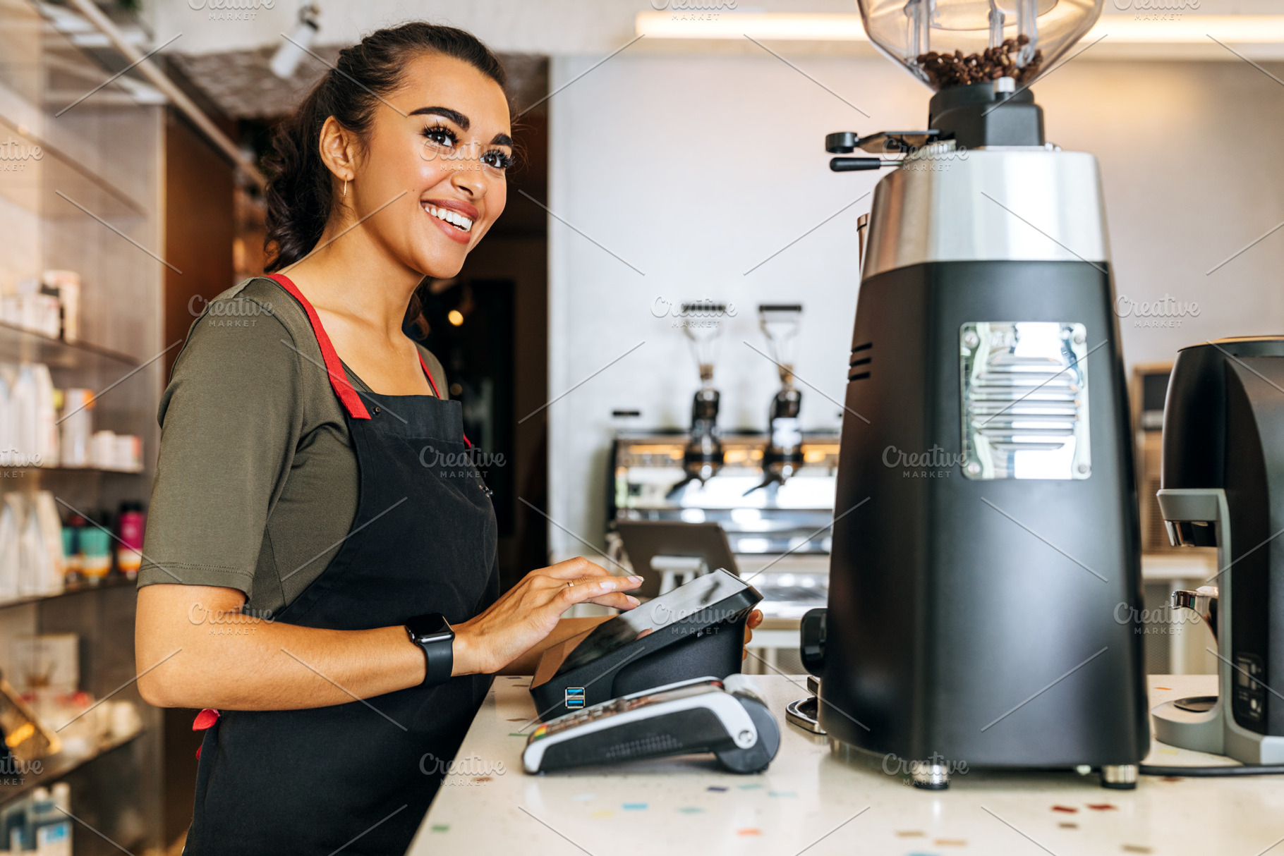 Female barista at counter, a Business Photo by Artem Varnitsin