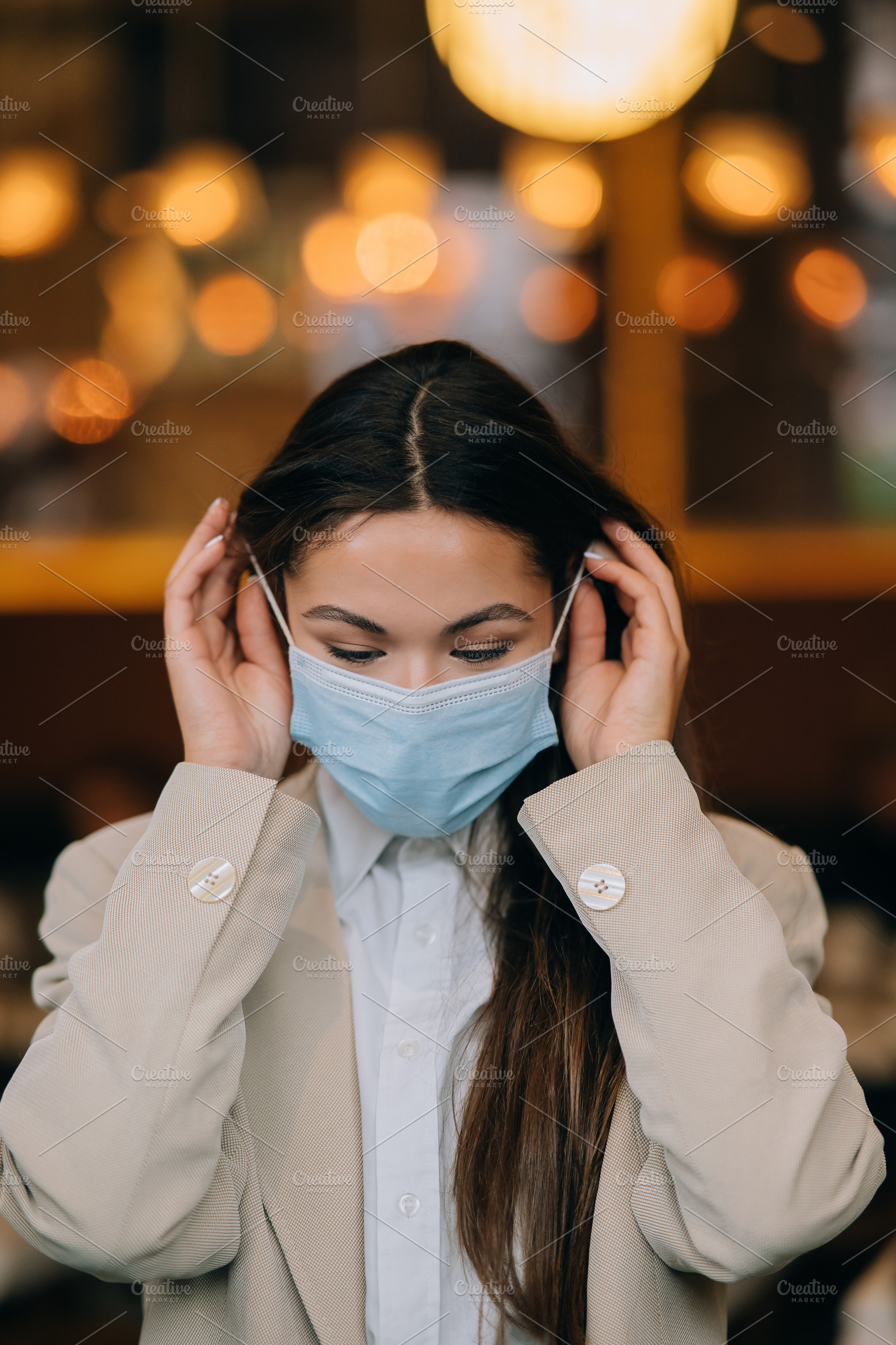 Girl in takes off her protective medical face mask, a Person Photo by Tekso