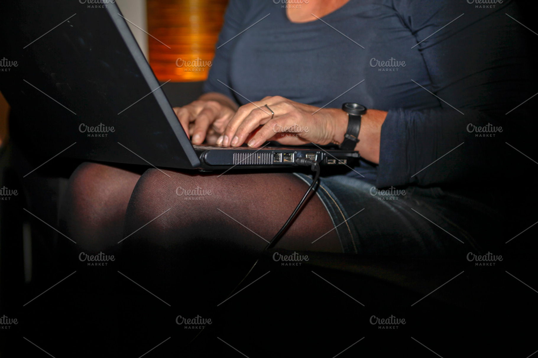Working on a laptop featuring woman, laptop, and working