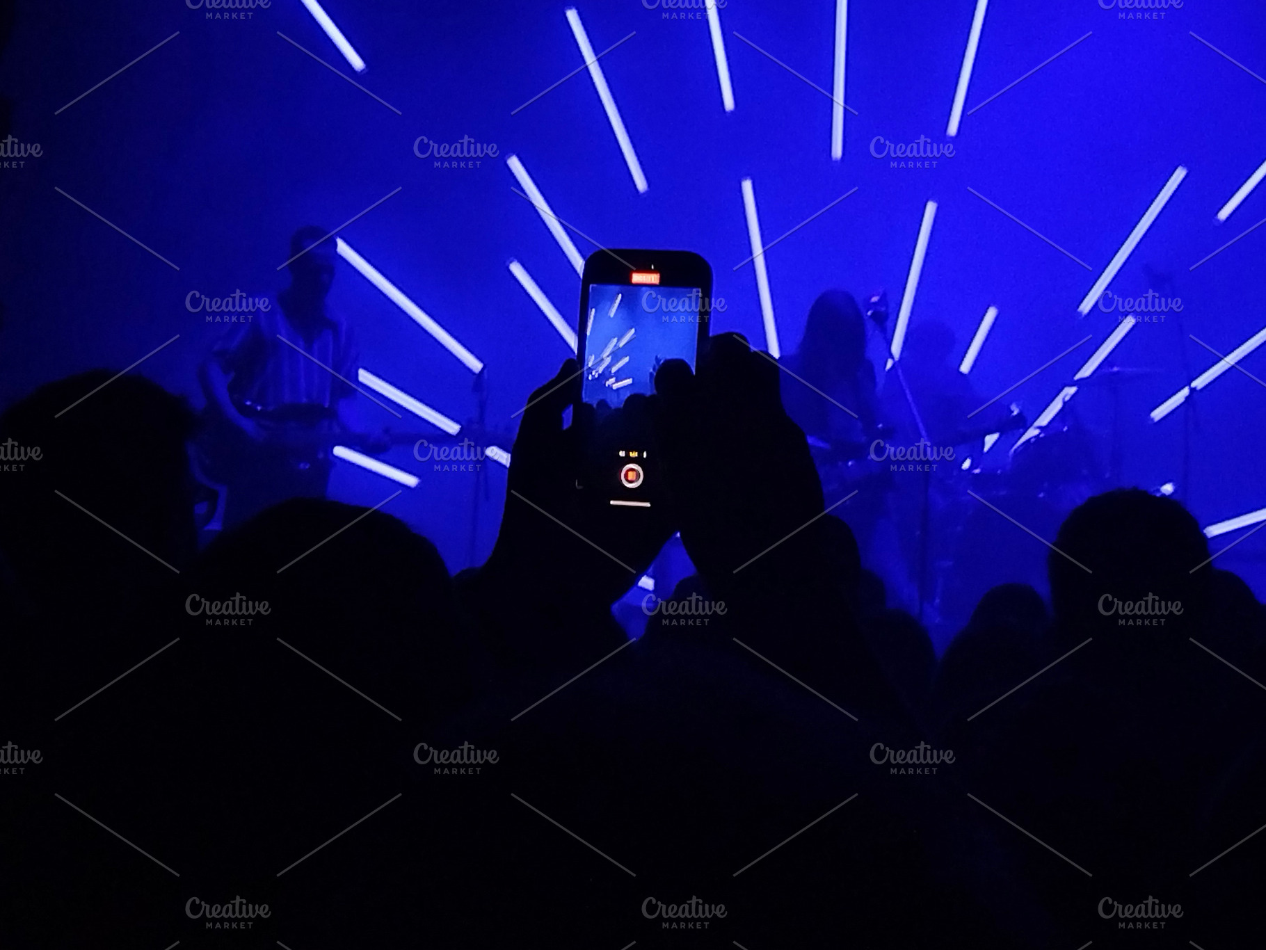 Live band on stage with radial light beams, an Arts & Entertainment Photo by DanFLCreativo