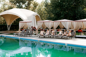young girls relaxing near the pool, a Person Photo by Weddings, People, Travel