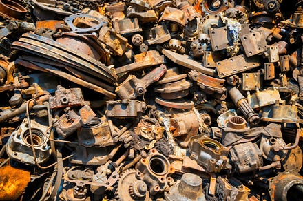 Closeup view of pile of old rusty metal scrap, an Industrial Photo by Vapi