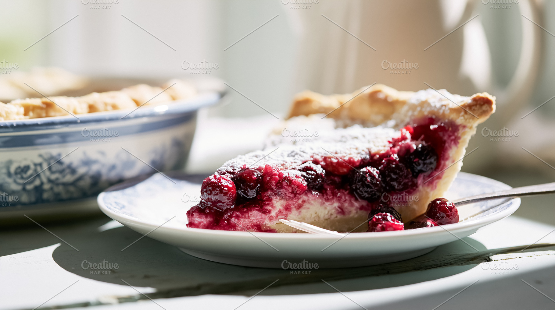Slice of berry pie dusted with powdered sugar on a plate, offering a taste of c, a Photo by Studio ANNA
