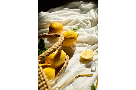 Bright summer lemons in a woven bag