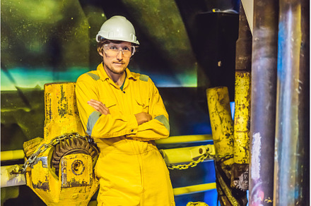 Young man in a yellow work uniform, a Person Photo by Elizaveta Galitskaya