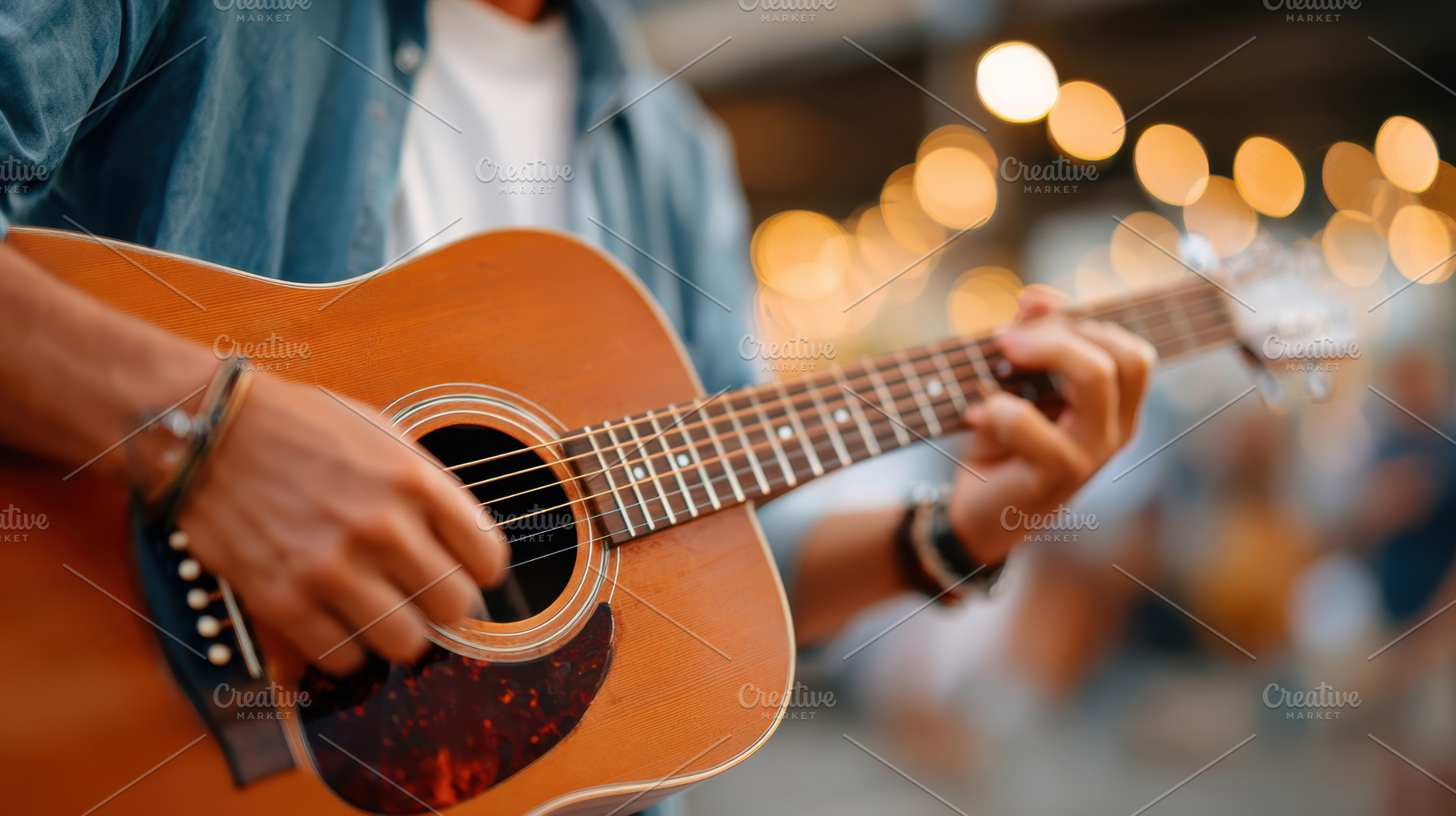Close-up of a musician playing acoustic guitar, an Arts & Entertainment Photo by AlyaAnd