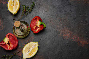 Red bell pepper halves, lemon, thyme sprigs, and a glass decante, a Food & Drink Photo by ndanko