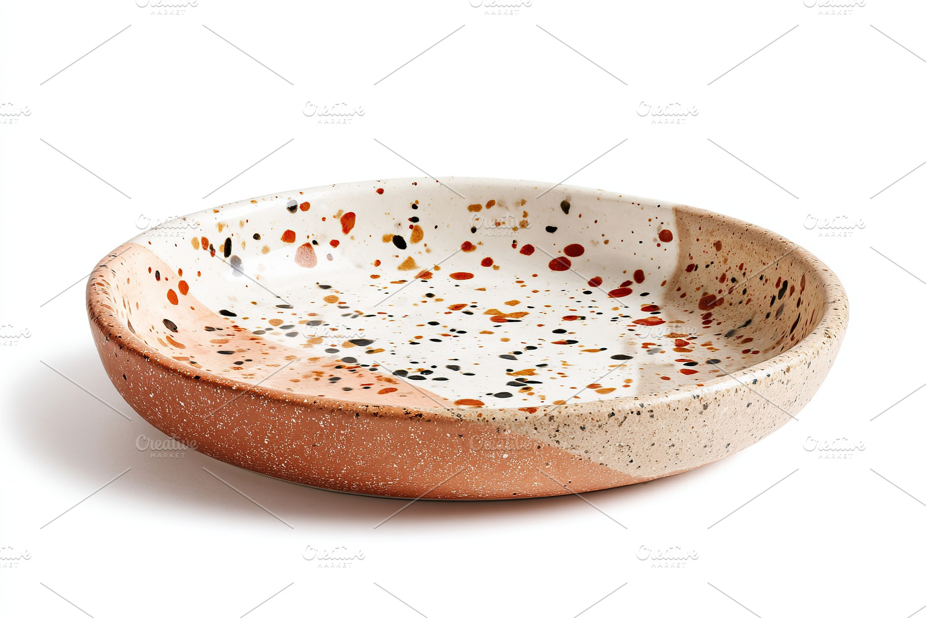 Round ceramic plate with colorful speckles perfect for serving on a dining tabl, a Food & Drink Photo by AlyaAnd