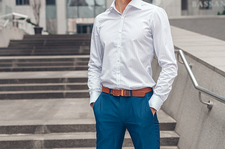 Businessman holds hands in his trouser pockets featuring businessman, a Person Photo by IvanRIVER Production