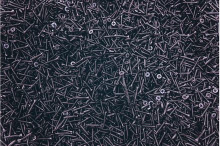 Lots of self-tapping screws close up, an Industrial Photo by yanadjana
