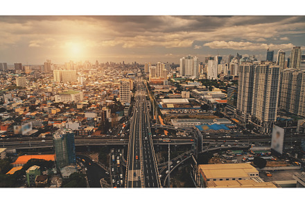 Cityscape at sun light with cross, an Architecture Photo by Goinyk
