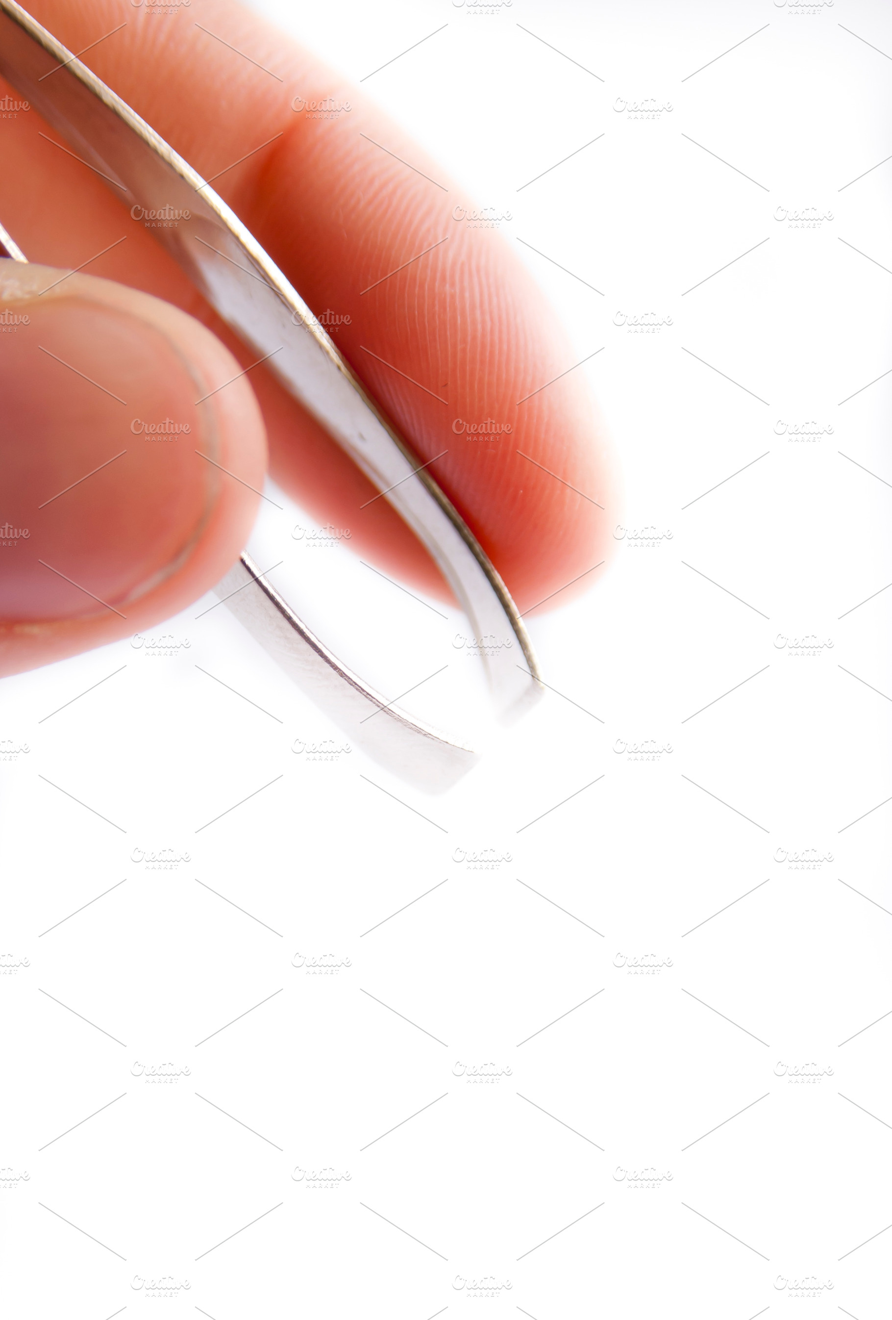 Holding Tweezers Isolated, a Beauty & Fashion Photo by THP Creative