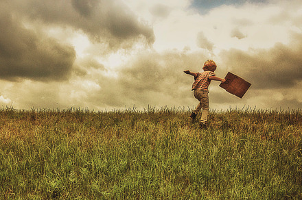 Boy Walking Across Grass With A Map preview 6