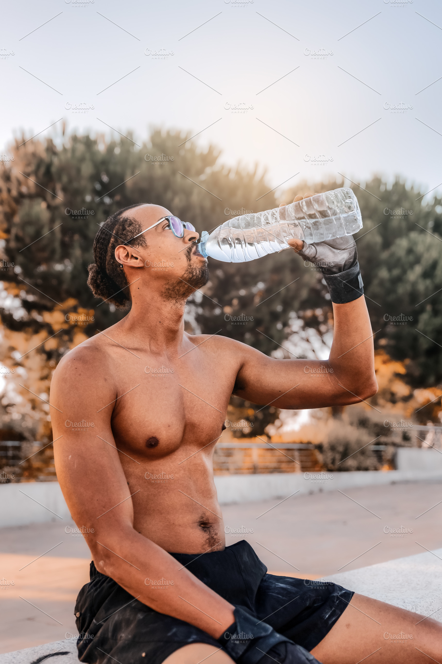 Athlete hydrating outdoors after tra, a Sports & Recreation Photo by Perpis