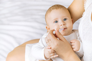 Mother gives medicine to baby for, a Health & Medical Photo by yanadjana