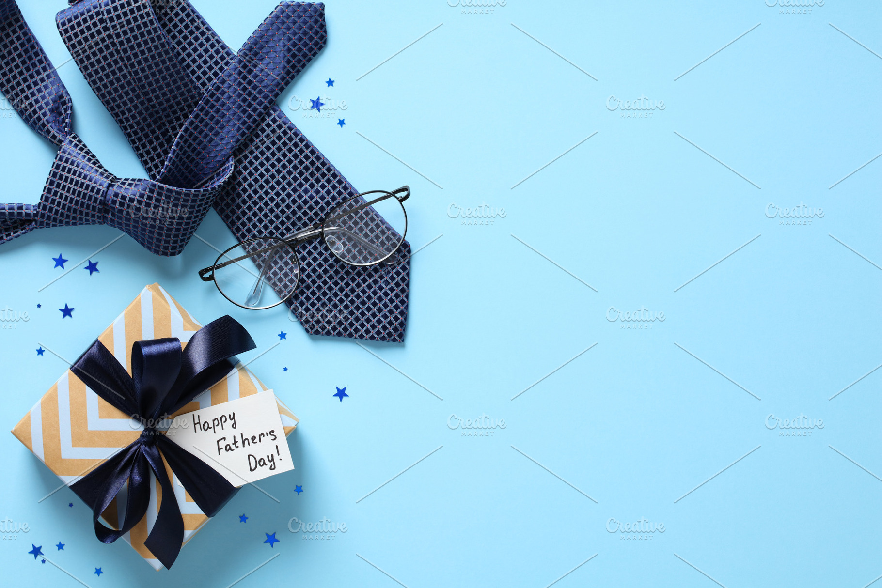 Flat lay composition with Fathers Day gift, necktie, eyeglasses, confetti on pa, a Holiday Photo by photoguns