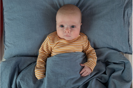 newborn baby boy in the bed, the, a Person Photo by Koldunova