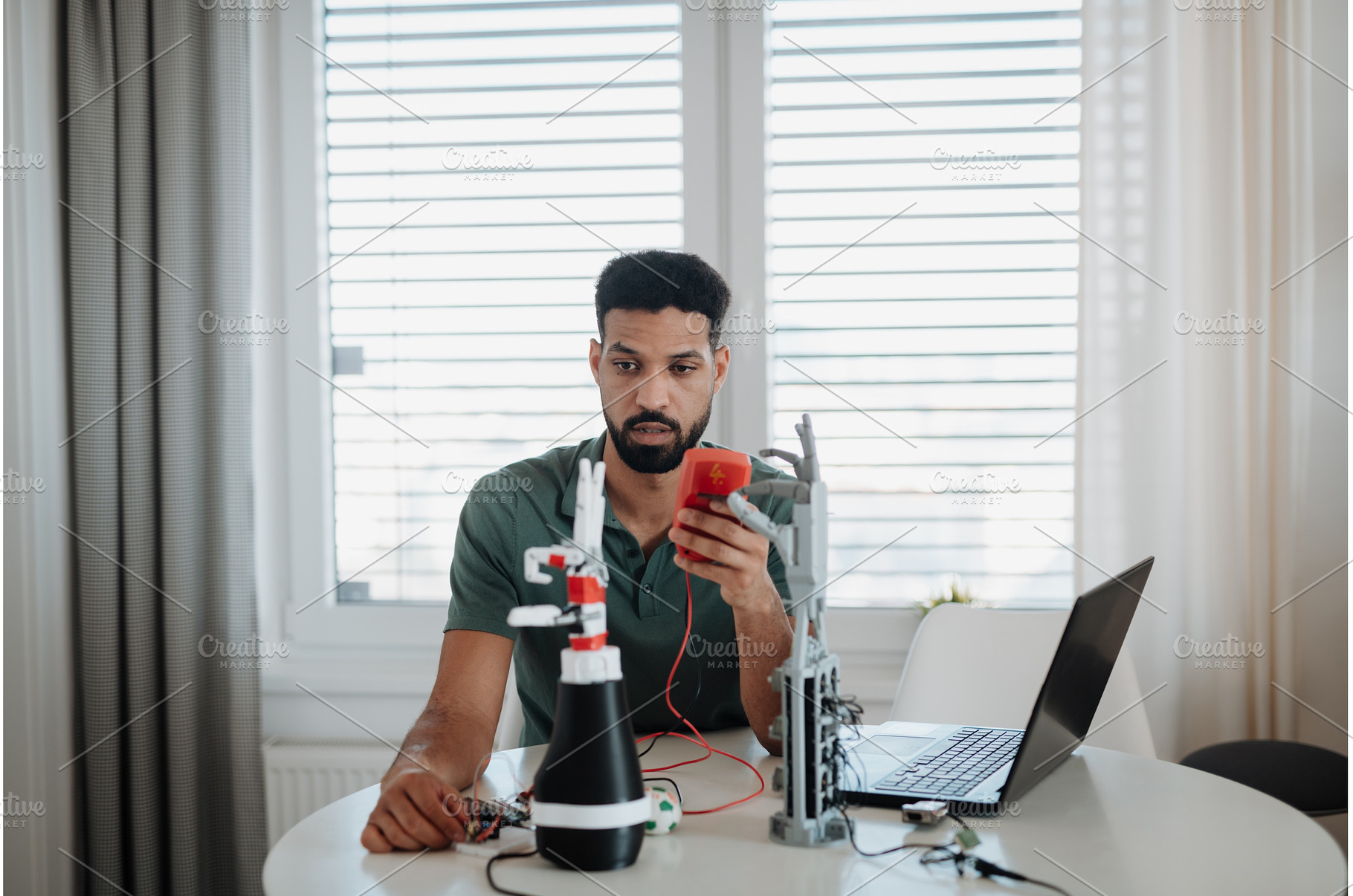 Engineer testing robotic arm, a Technology Photo by HalfPoint