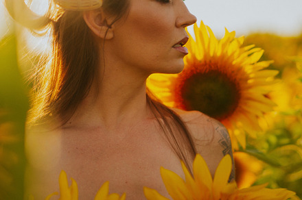 woman in a field of sunflowers