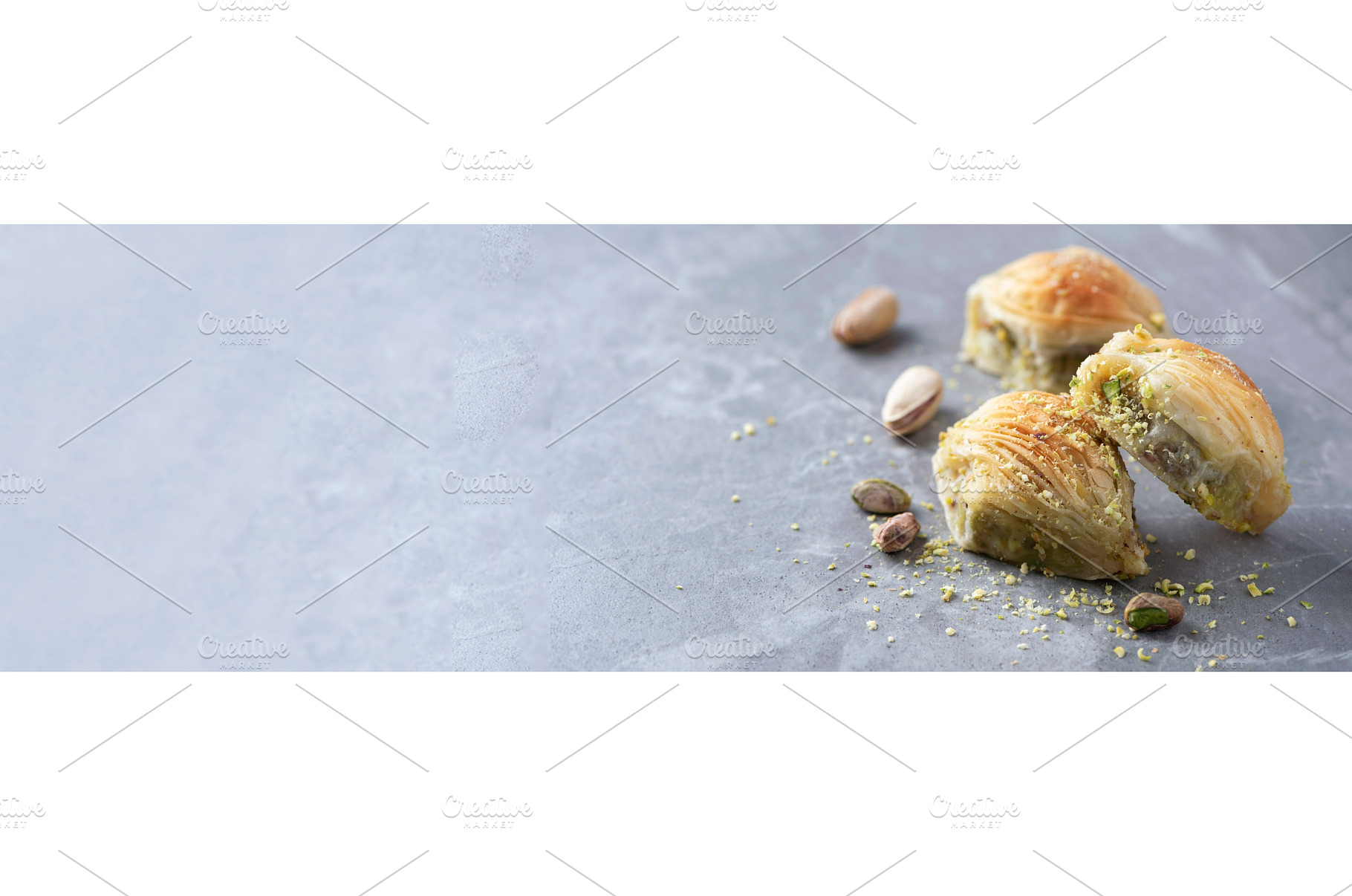 Baklava with pistachios on grey, a Food & Drink Photo by Enjoy Photo