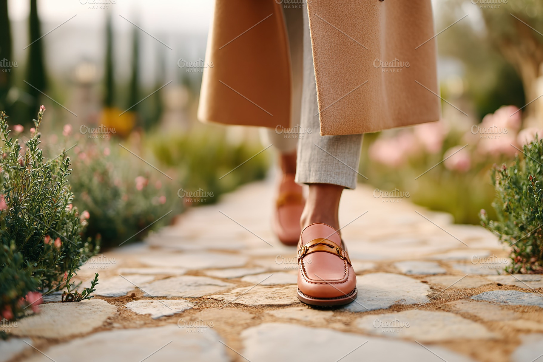 Walking through a garden path in a long beige coat and stylish leather shoes, a Photo by AlyaAnd