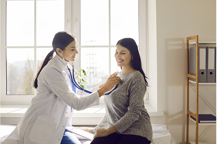 Female patient in clinic for checkup, a Health & Medical Photo by StudioRomantic
