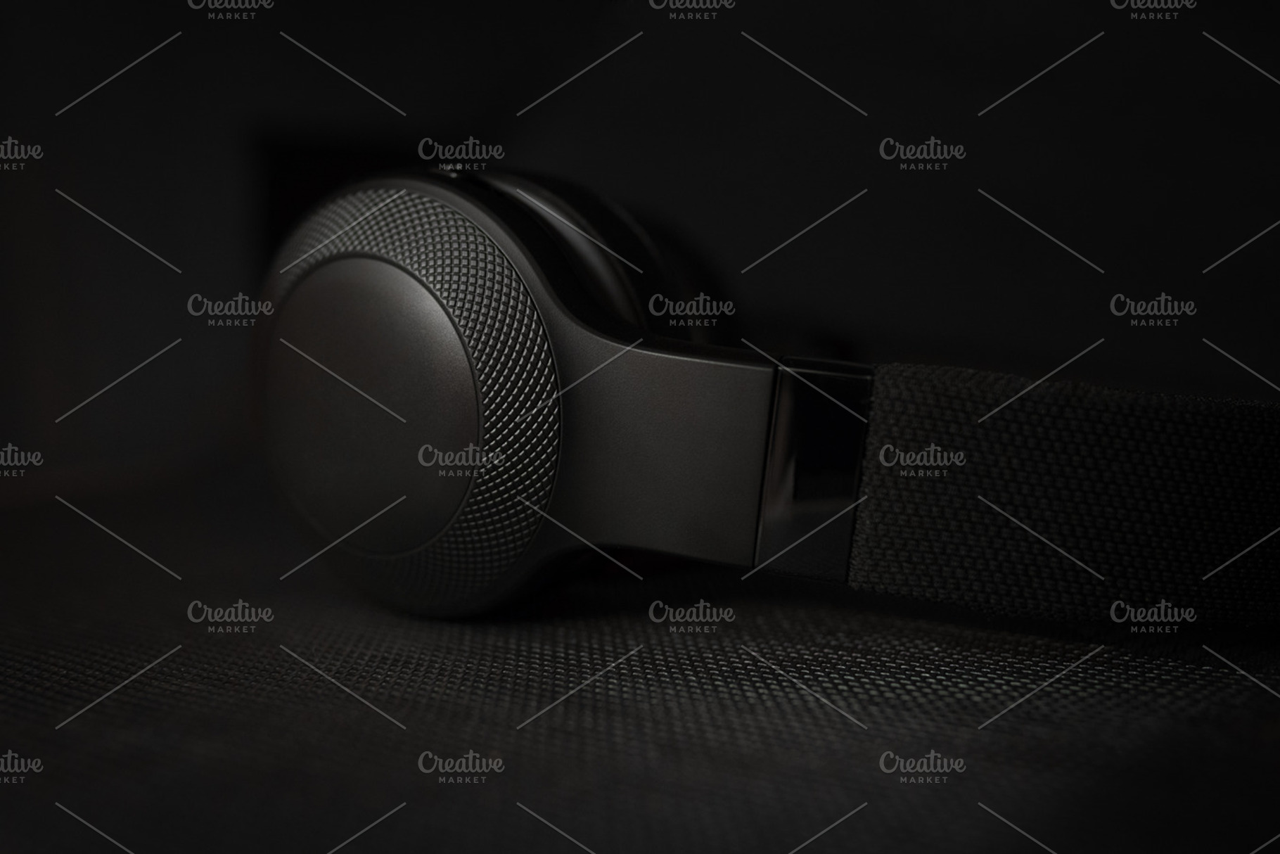 Black headphones in dark, a Technology Photo by Juicy Photography