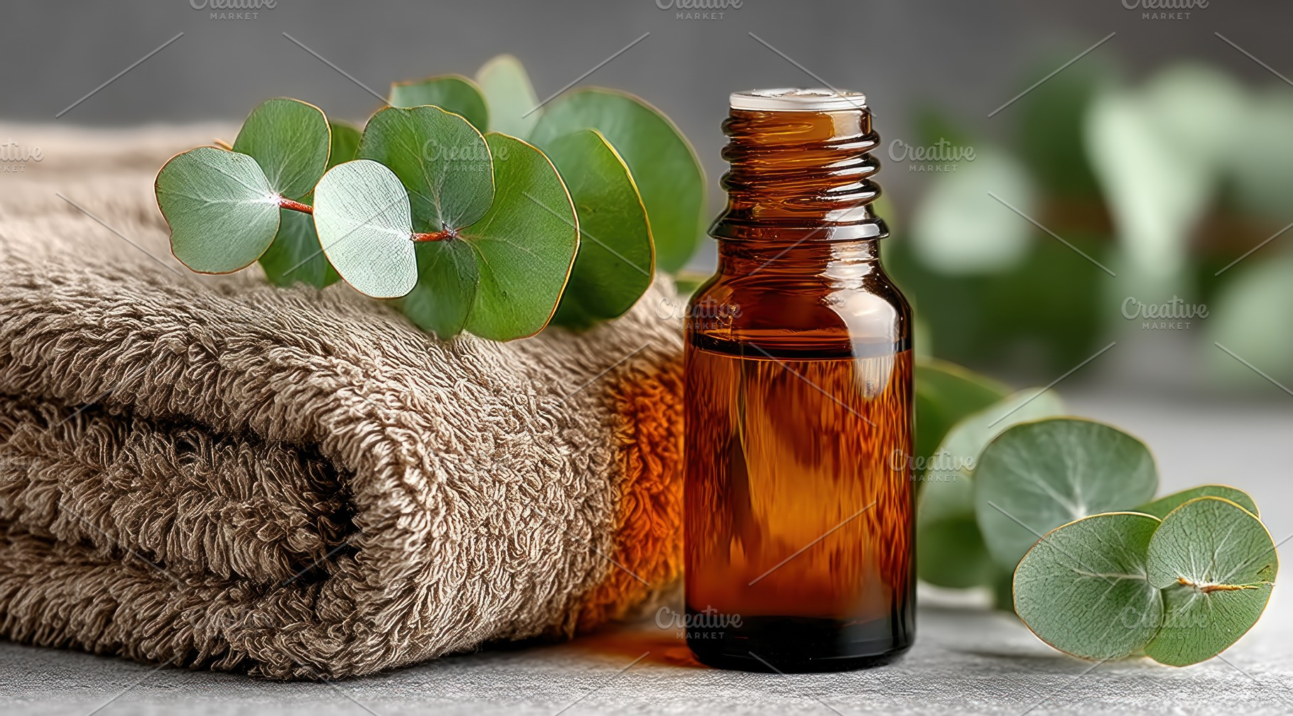 Amber glass essential oil bottle with eucalyptus leaves and soft, an Animal Photo by José Manuel Gelpi