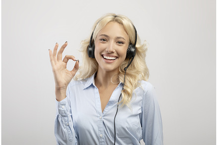 Happy female call centre operator, a Person Photo by Prostock-Studio