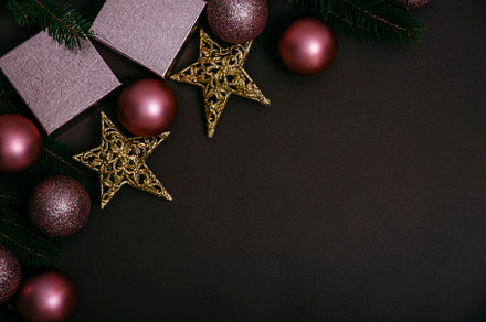 Pink christmas balls on brown background top view. Shiny christm, a Holiday Photo by hitdelight