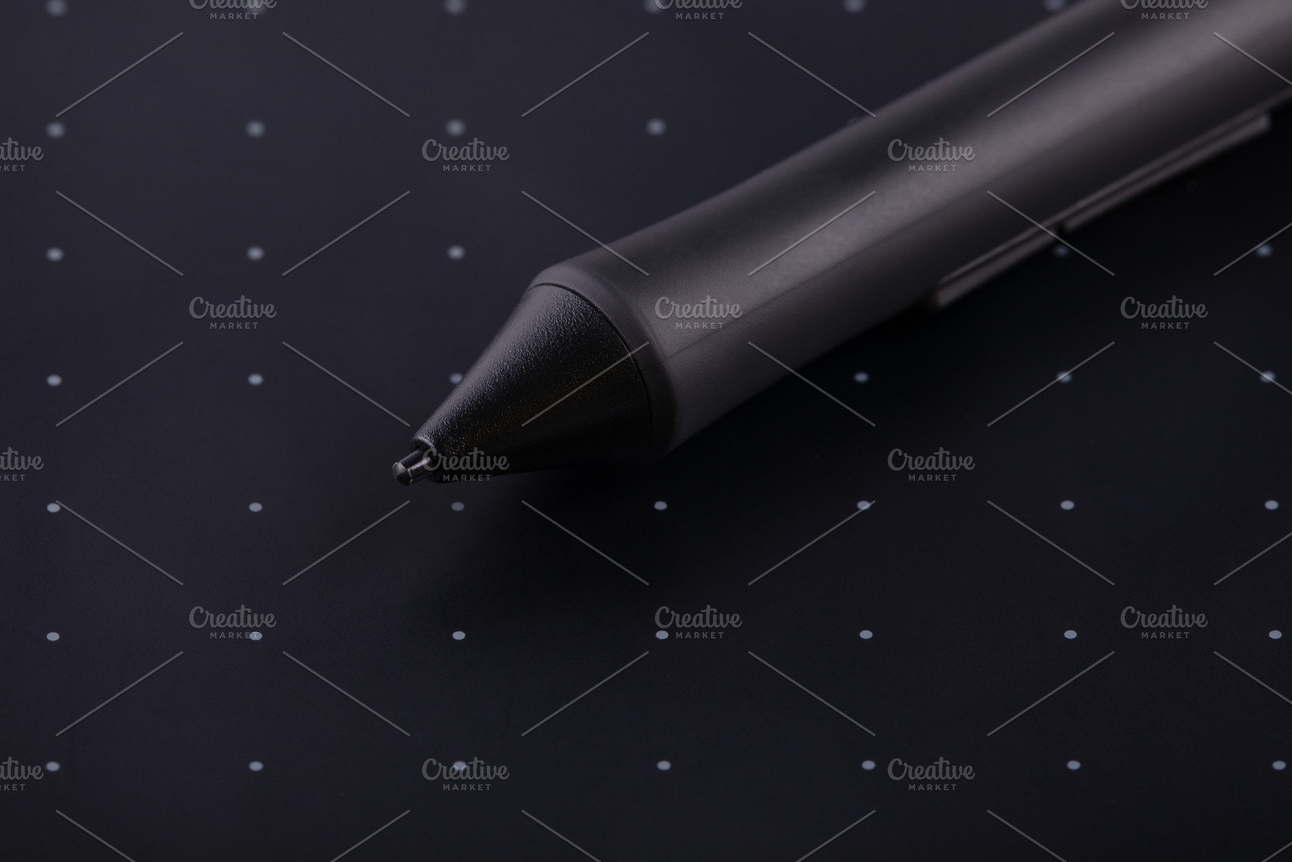 Close-up of a digital stylus resting on a black graphic tablet w, a Technology Photo by Ales Munt