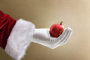 Background with Santa's hand holding Christmas decorative ball i, a Holiday Photo by Davizro's Market