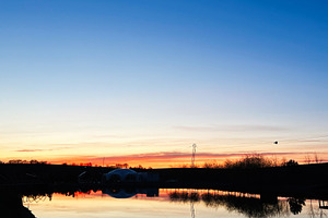 Scenic sunset over a still water lake with a vibrant sky reflection, a Photo by AS photostudio