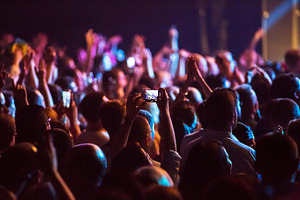 Crowd at concert and blurred stage lights  containing crowd, people, and event, a Person Photo by suprunvitaly