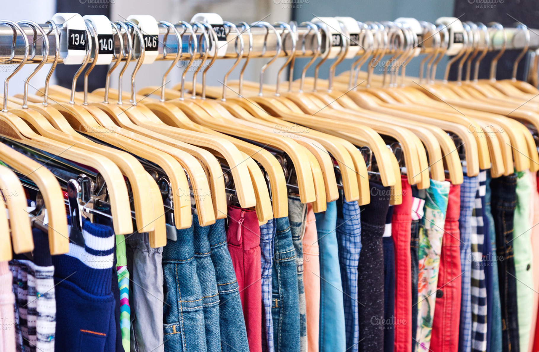Casual clothing on wooden hangers, a Beauty & Fashion Photo by BOOCYS