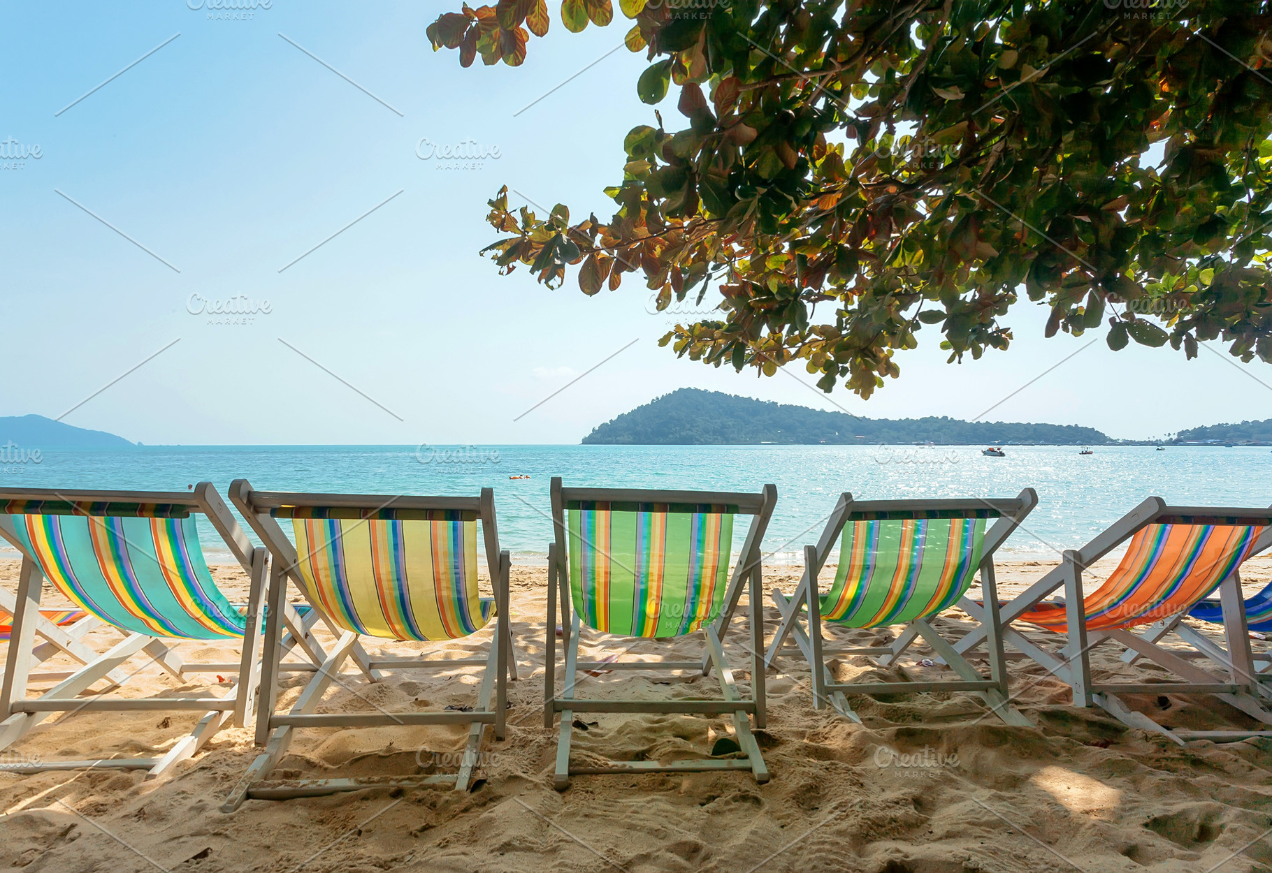 Line of colorful sun lounges, a Nature Photo by Radiokafka