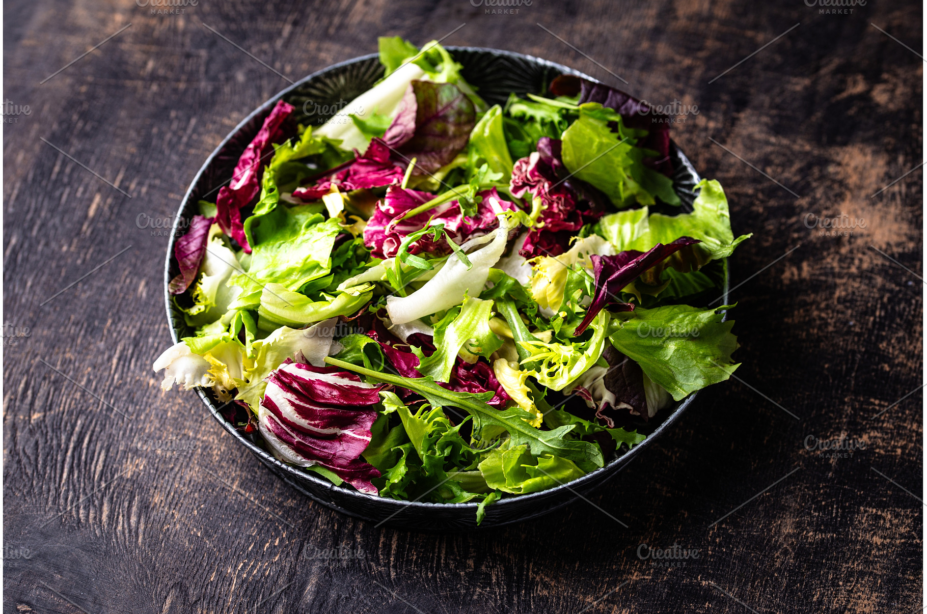 Bowl of fresh green salad mix, a Food & Drink Photo by Yulia Furman