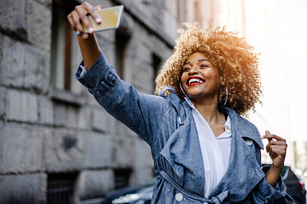 Beautiful black woman on street, a Person Photo by REDDOT Studio