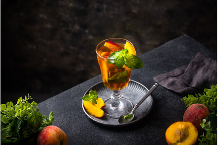 Cold ice tea with peach and mint, a Food & Drink Photo by Yulia Furman