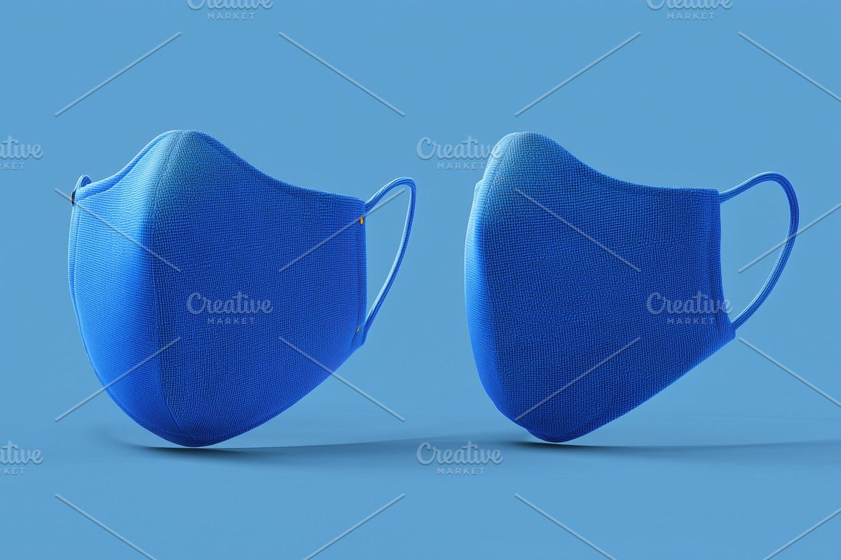 Two blue fabric face masks mockup on a blue background, a Mask Mockup by Textures & Backgrounds