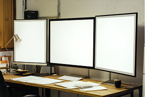 Blank posters in office, a Business Photo by VetalStock